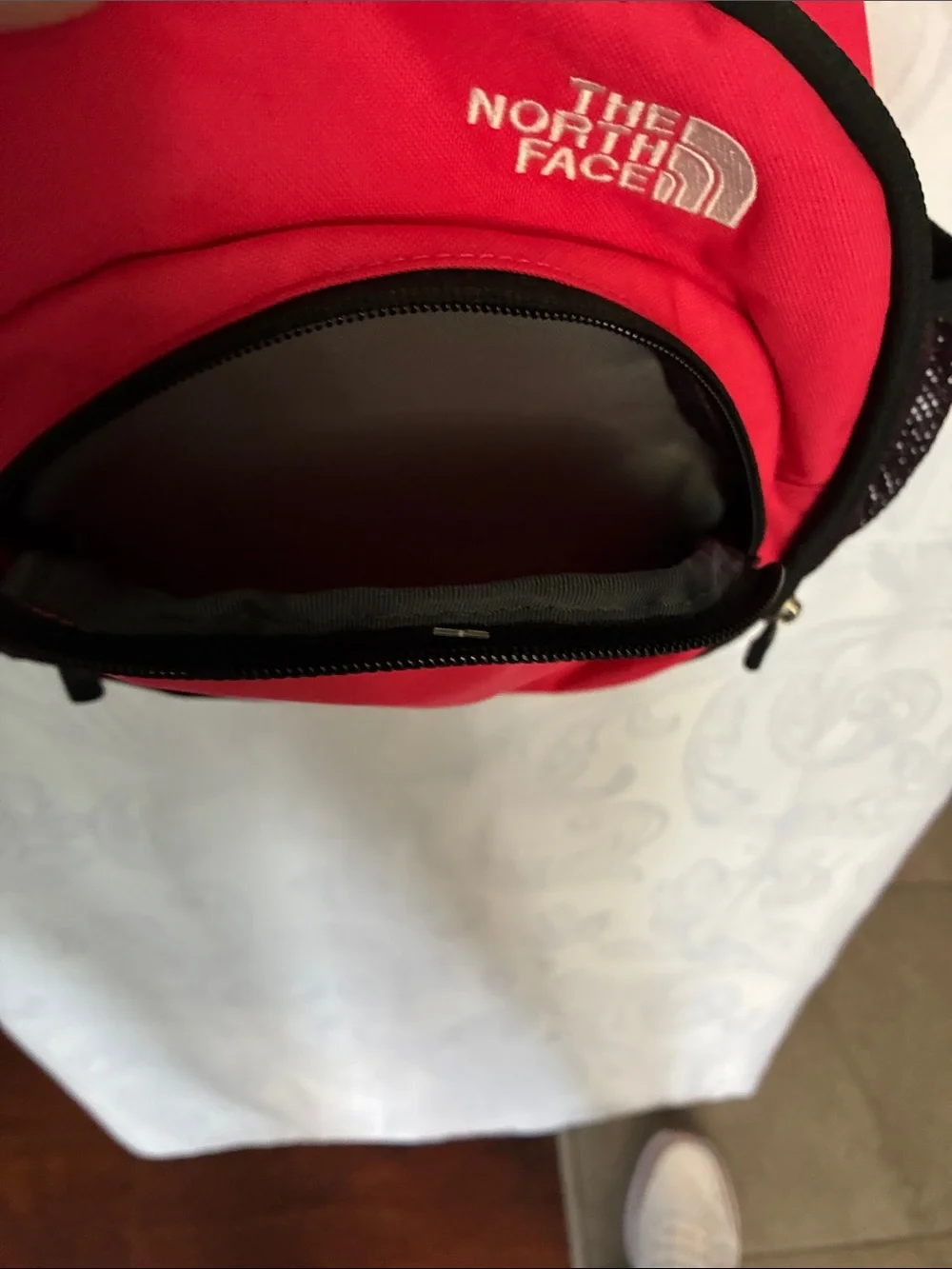 The North Face red and black Sprout backpack